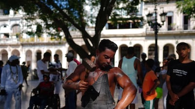 Cuba's 'Ironman' Lino Tomasen performs in downtown Havana, Cuba, on August 8. Reuters