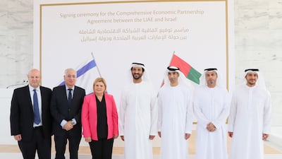 Abdulla bin Touq, UAE Minister of Economy, centre, and Dr Thani Al Zeyoudi, UAE Minister of State for Foreign Trade, third from right, with Orna Barbivai, Israel's former Economy Minister, third from left, and the negotiating teams from each country. Photo: Ministry of Economy