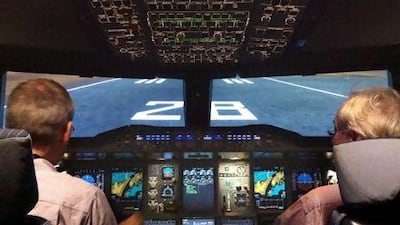 Captain Geert Pruss with The National's aviation reporter David Black, right, in an A380 simulator at Lufthansa's facility in Frankfurt. Courtesy Lufthansa