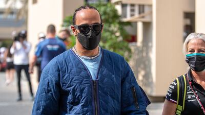 Mercedes driver Lewis Hamilton of Britain arrives at the Yas Marina Circuit in Abu Dhabi. Victor Besa / The National
