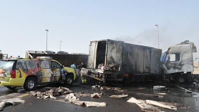 Three cars and two lorries collided on Al Fayah Road, heading to Dubai, at around 7am on Thursday, leaving two dead. Courtesy Security Media