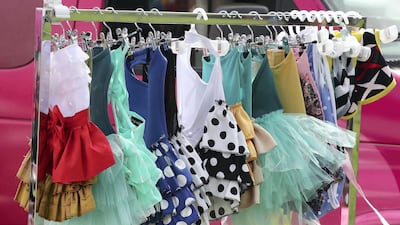 Clothes for pets on display at the Shampooch stand at the Abu Dhabi Pet Festival. Pawan Singh / The National