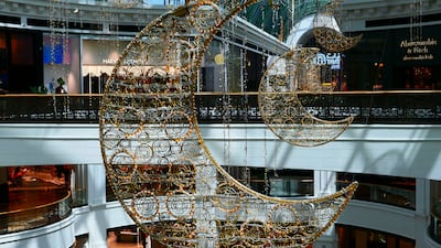 Crescent moons hang from the ceilings at Mall of the Emirates. Pawan Singh / The National