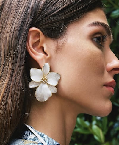 Statement accessories can lift the simplest outfit. Seen here, Orchid Imperial diamond earring by Begum Khan