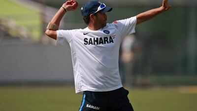 Indian cricketer Sachin Tendulkar prepares to throw a ball during a practice session ahead of the second cricket test match against Bangladesh in Dhaka, Bangladesh, Saturday, Jan. 23, 2010. (AP Photo/Pavel Rahman) *** Local Caption *** DEL119_Bangladesh_India_Cricket_.jpg
