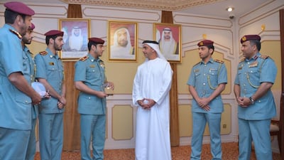 Sheikh Saif bin Zayed, Deputy Prime Minister and Minister of Interior, is shown the two awards won by Abu Dhabi Police. Wam