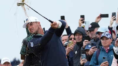 Bryson DeChambeau plays from the rough on the third hole. AP