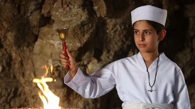 An Iraqi Kurdish Zoroastrian takes part in a ritual ceremony in an ancient and ruined temple of the Zoroastrian religion in the Iraqi Kurdish town of Darbandikhan. AFP