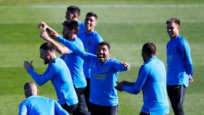 Boca Juniors players, including Carlos Tevez, train at Real Madrid's training complex ahead of the Copa Libertadores second leg on Sunday. Reuters