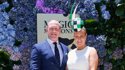 Zara Tindall, wearing a white dress with a black and green headpiece, and Mike Tindall attend the Magic Millions Raceday on January 14, 2017 in Australia. Getty Images