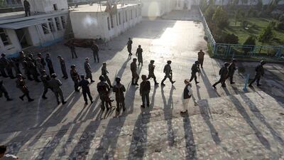 Afghan security police arrive at a Shiite mosque where gunmen attacked during Friday prayers, in Kabul, Afghanistan. Rahmat Gul / AP Photo