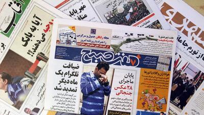TO GO WITH AFP STORY OF ALI NOORANI A picture taken on December 6, 2015 in Tehran shows the front page of the Iranian daily "Seven Morning" reporting the detention of Vahid (picture), 30, after he shared with a phone application pictures of him surrounded by women. Over the past eight months 609 men and 114 women have been arrested suspect of "economic, social and moral cyber crimes". AFP PHOTO / ATTA KENARE / AFP / ATTA KENARE