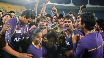 Shahrukh Khan, wearing glasses, owner of the Kolkata Knight Riders, celebrates alongside his players after they won the Indian Premier League title last year. Apart from the format, the IPL owes its success to the involvement of the country's big corporations and Bollywood stars such as Shahrukh. Aijaz Rahi / AP Photo