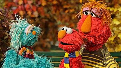 Rosita, left, talks to Elmo and his father Louie during an episode of Sesame Street.