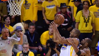 Andre Iguodala of the Golden State Warriors shoots under pressure from Tristan Thompson of the Cleveland Cavaliers during Game 5 of the 2015 NBA Finals on June 14, 2015 at the Oracle Arena in Oakland, California. AFP PHOTO / FREDERIC J. BROWN