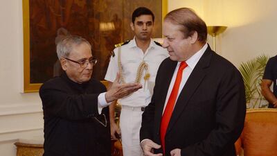 Indian President Pranab Mukherjee (L) shakes hand with Pakistan Prime Minister Nawaz Sharif during a meeting in New Delhi, India. The latest round of high-level meetings between the two Asian giants was unexpectedly cancelled by India. (Photo: EPA/HO)