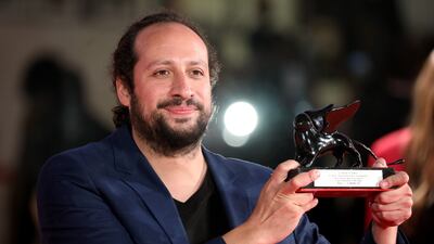 Director Kiro Russo with the Special Orizzonti Jury Prize for 'El Gran Movimento'. Getty Images
