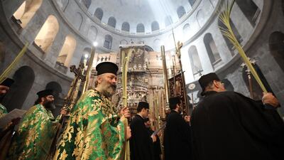 Greek Orthodox clergymen attend the procession in Jerusalem. Palm Sunday in when many churches symbolically mark the biblical account of the entry of Jesus into Jerusalem. EPA