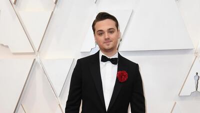 Dean-Charles Chapman, wearing Celine, arrives at the Oscars on Sunday, February 9, 2020, at the Dolby Theatre in Los Angeles. AP