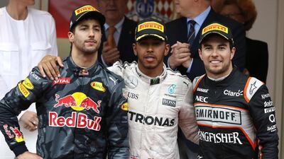 Sergio Perez, right, alongside Lewis Hamilton, centre, and Daniel Ricciardo following his third place finish at the Monaco Grand Prix. Eric Gaillard / Reuters