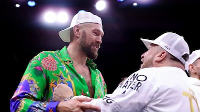 WBC heavyweight champion Tyson Fury celebrates with the Fury Coaching Team after half-brother Tommy Fury beat Jake Paul by split decision. Getty Images