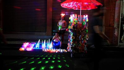 A woman and her son sell toys during the Lantern Festival celebrating the eve of the nativity of the Virgin Mary in Ahuchapan, El Salvador. Jose Cabezas / Reuters
