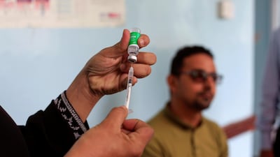 A man waits to receive the AstraZeneca vaccine against Covid-19 at a medical centre in Taez, Yemen. Reuters