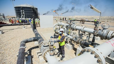 A worker adjusts a valve on a pipeline at Majnoon oilfield, near Basra, Iraq. The country is seeking to step up its oil exports. Reuters