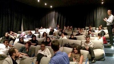 The communal space at A$ in Dubai features a small screening room with beanbag chairs. Courtesy A4