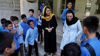 Freshta Karim, 27, (C) , founder of the mobile library bus, speaks to school boys in Kabul, Afghanistan earlier this month. Photos: Reuters / Mohammed Ismail