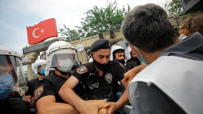 Protestors opposing President Recep Tayyip Erdogan's Istanbul Canal project scuffle with Turkish police officers on June 26, 2021. AP Photo