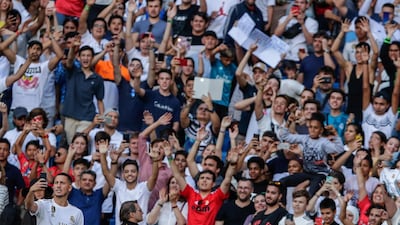 Eden Hazard takes photos with supporters inside the Bernabeu stadium. AP Photo