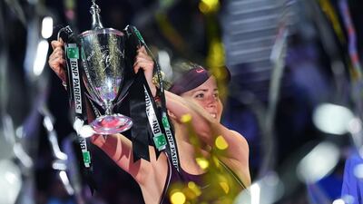 Elina Svitolina celebrates with the WTA Finals trophy after beating Sloane Stephens in the final. AFP