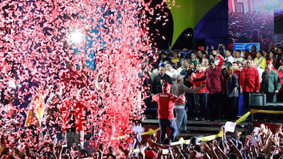 Confetti falls as supporters walk up to greet Venezuela's President Nicolas Maduro during a gathering after the results of the election were released, outside of the Miraflores Palace in Caracas, Venezuela. Carlos Garcia Rawlins / Reuters