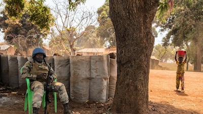 A Gabonese UN peacekeeper rests at a fortified position on the road to a camp for displaced people in Bria, a rebel-held town in CAR