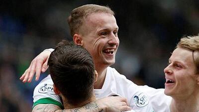 Celtic's Leigh Griffiths celebrates his goal against St Johnstone with teammates during their Scottish Premier League soccer match at McDiarmid Park Stadium in Perth, Scotland February 14, 2015. REUTERS/Russell Cheyne