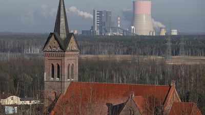 A village church stands near the Jaworzno II coal-fired power station in the coal-heavy region in Poland. Sean Gallup / Getty Images