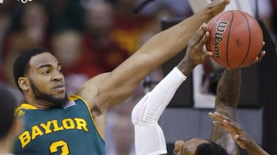 Iowa State guard DeAndre Kane, right, is fouled by Baylor forward Rico Gathers during the first half of an NCAA college basketball game in the final of the Big 12 Conference men's tournament in Kansas City, Mo., Saturday, March 15, 2014. AP Photo/Orlin Wagner