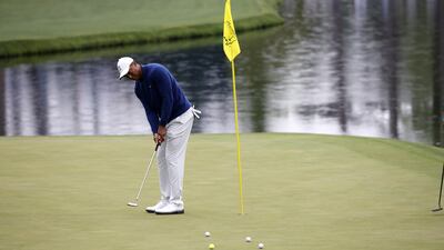 Tiger Woods putts on the 16th green during a practice round ahead of The Masters at the Augusta National Golf Club. EPA