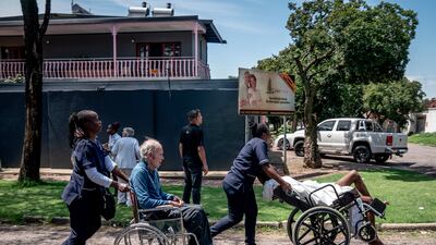 Residents are taken away from an old people's home near the scene of the explosion. AP
