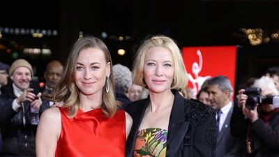 Yvonne Strahovski, left, and Cate Blanchett in a strapless Dries van Noten dress, right, attend the Berlinale Series Premiere for the film, 'Stateless', during the 2020 Berlinale Film Festival. AP
