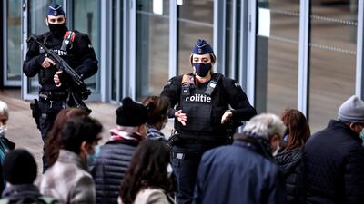 Belgian police officers stand guard at the entrance to the Antwerp courthouse in November. Assadollah Assadi refused to leave his prison cell at the start of his criminal trial. AFP