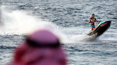 A Saudi holiday maker rides a jet ski at Red Sea resort of Obhur, in Jiddah, Saudi Arabia. AP Photo