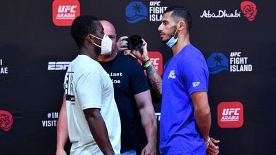 Abdul Razak Alhassan of Ghana and Dubai-based Mounir Lazzez of Tunisia face off during the UFC Fight Night weigh-in.