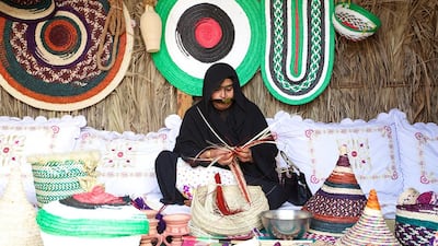 A woman weaving at Qasr Al Hosn. Courtesy Qasr Al Hosn