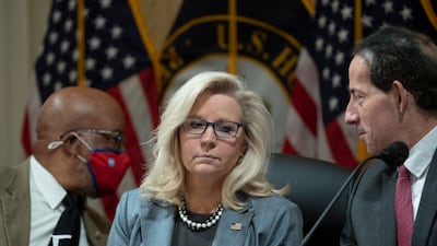 Liz Cheney, Bennie Thompson and Jamie Raskin consider a report at a meeting. EPA