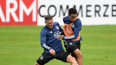 Germany's David Raum and Jamal Musiala during training. Reuters