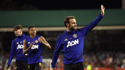 Manchester United midfielder Juan Mata waves to fans. EPA