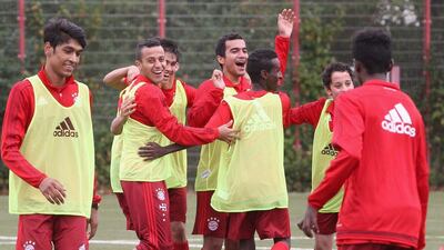 Thiago, second left, of Bayern Munich celebrates a goal at a training camp for refugee youths this week put on by the club. Alexandra Beier / Bongarts / Getty Images
