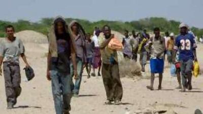 Refugees who arrived on Yemen's shores hours earlier make their way 35km to the UN High Commission for Refugees reception center at Ahwar.
